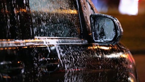 Night car wash with reflections
