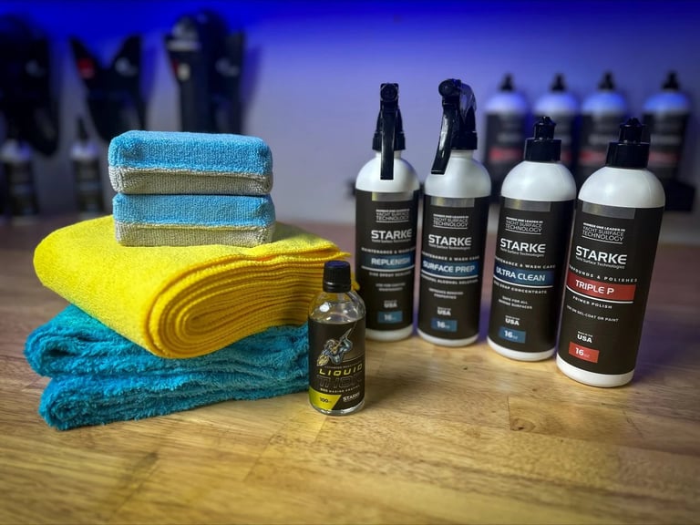 Starke Yacht Care products and microfiber towels arranged on wooden surface